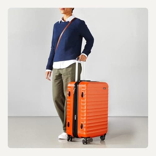 Amazon Basics Hard Shell Medium Suitcase - Expandable ABS Travel Luggage with 4 Double Spinner Wheels - Scratch Resistant and Lightweight Construction - 68 x 45.1 x 28.6cm - Burnt Orange — view 3