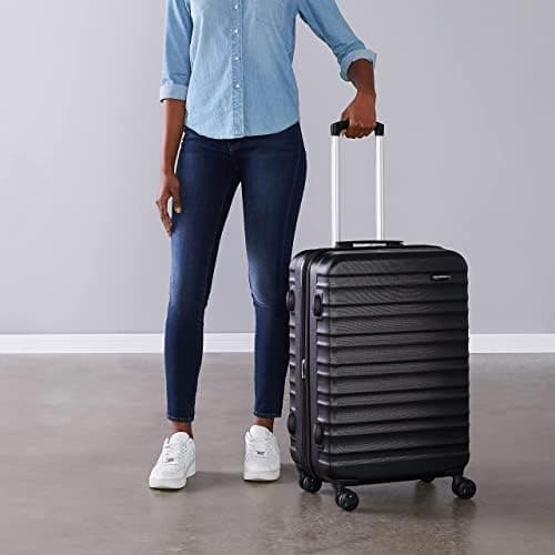 Amazon Basics Hard Shell Medium Suitcase - Expandable ABS Travel Luggage with 4 Double Spinner Wheels - Scratch Resistant and Lightweight Construction - 68 x 45.1 x 28.6cm - Black — view 6