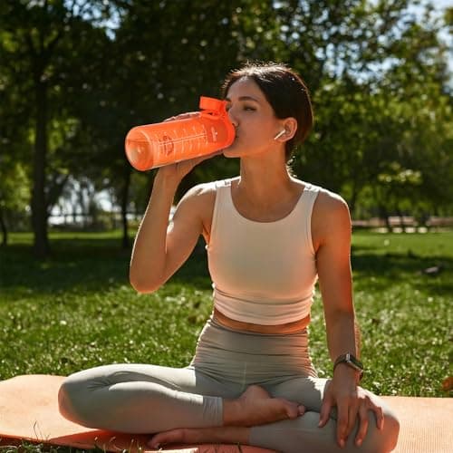 GOPPUS 1L/32oz Clear Tritan Water Bottle with Screw Lid, Drinks Bottle with Wide Mouth, Fruit Infuser, Leakproof, BPA Free, Carry Handle, Measurement Markings, Dust Cap (Orange) — view 6