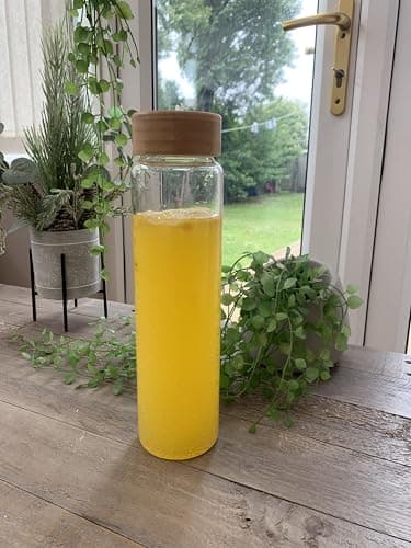 Borosilicate Glass Drinking Bottle, 1L Capacity with leak resistant Bamboo Lid, elegant, transparent, for Water, Beverages and Infused Drinks Storage. — view 6